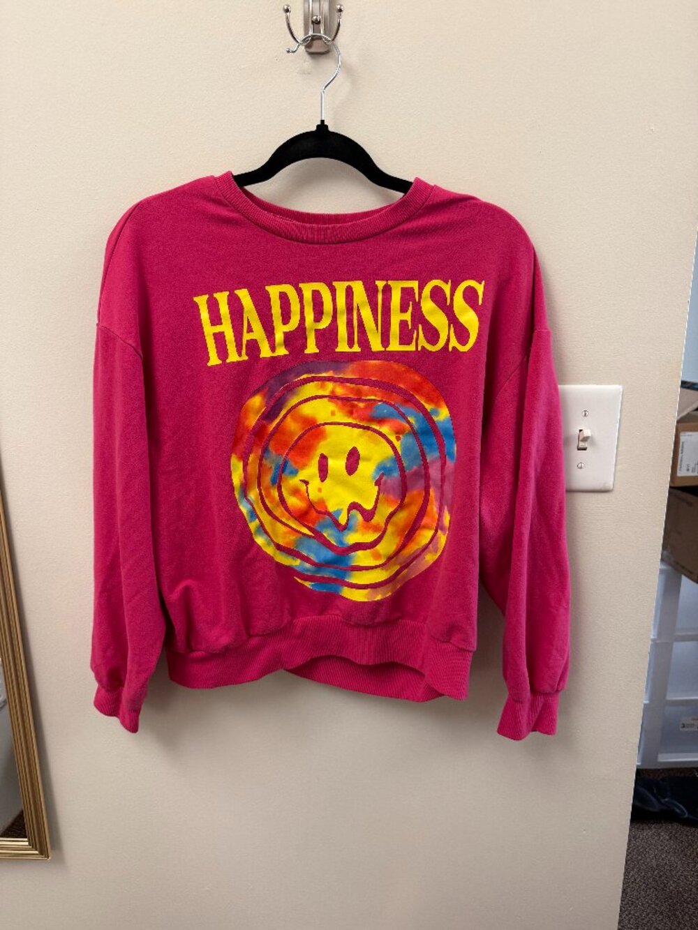 pink sweatshirt with yellow print "happiness"